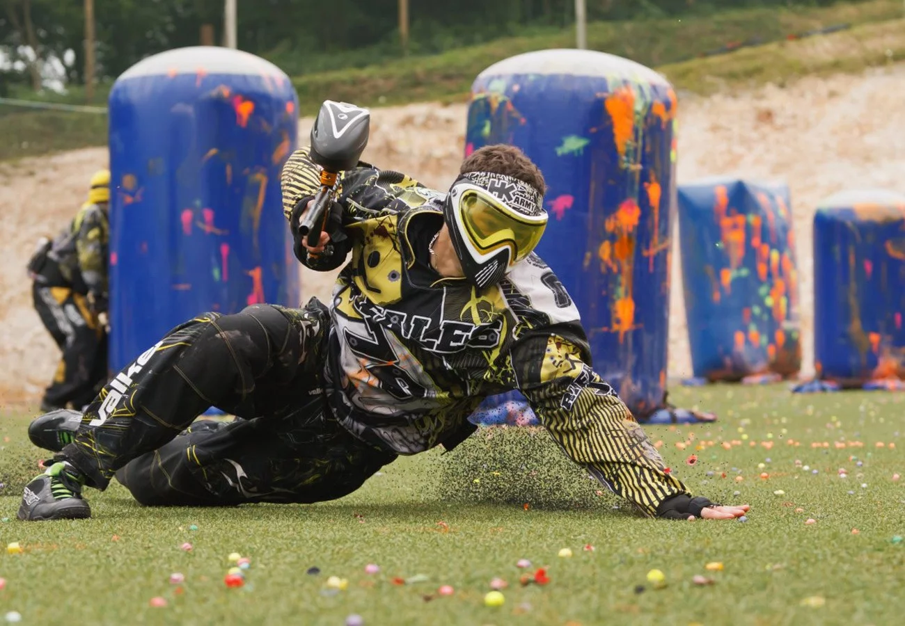 Player wearing a protective paintball mask